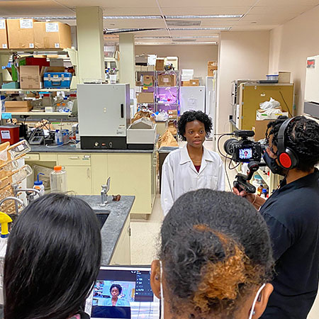 HS youth filming in lab.